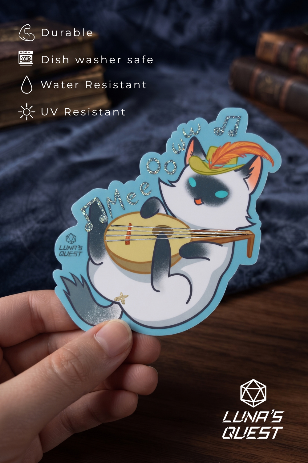 An illustrated white cat wearing a feathered cap playing a lute, with a blue border and decorative details.  The cat is a bard class. Text on the left lists product features like durable, dish washer safe, water resistant, and UV resistant.